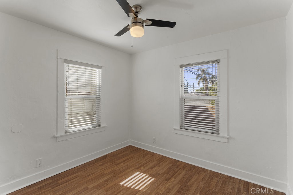 224 West 14th Street Long Beach, CA 90813 - Photo 15 of 31 a view of an empty room with wooden floor and a window