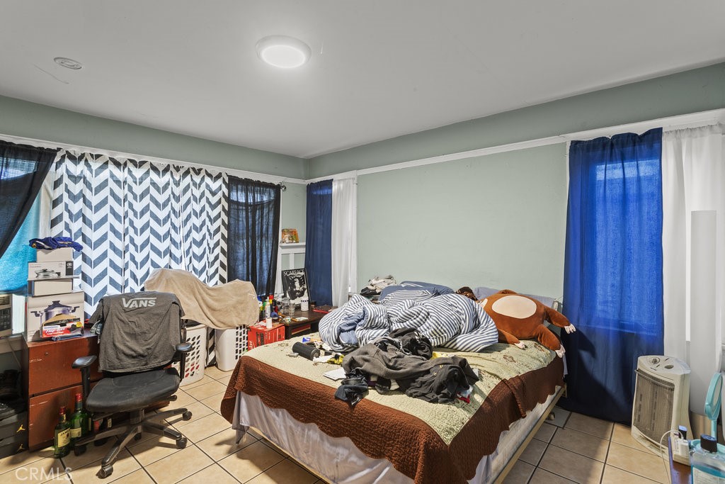 224 West 14th Street Long Beach, CA 90813 - Photo 23 of 31 a bedroom with a bed and wooden floor