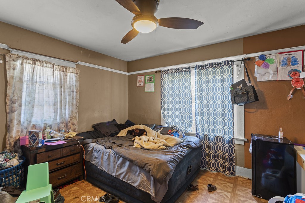 224 West 14th Street Long Beach, CA 90813 - Photo 24 of 31 a bedroom with a bed and wooden floor