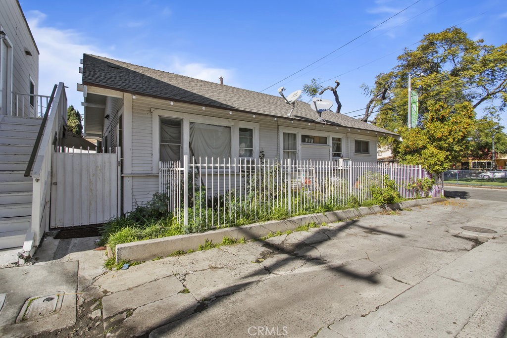 224 West 14th Street Long Beach, CA 90813 - Photo 29 of 31 a view of a house with a small yard and potted plants