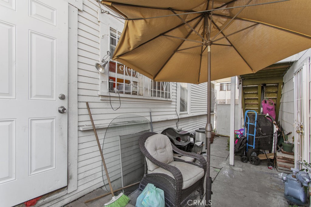 224 West 14th Street Long Beach, CA 90813 - Photo 30 of 31 a view of a patio with table and chairs under an umbrella