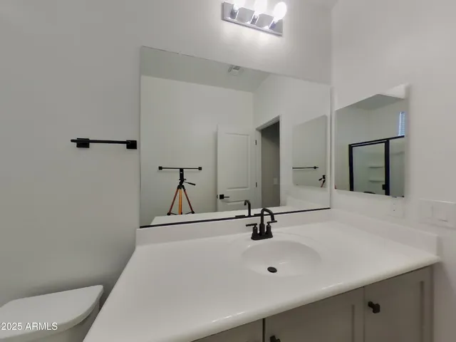 a bathroom with a shower and toilet