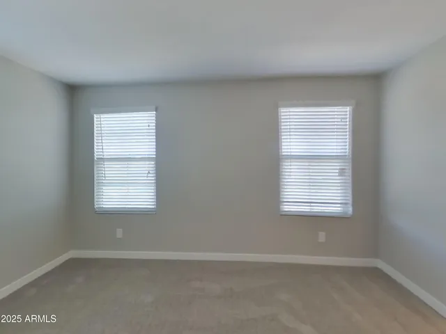 a kitchen with granite countertop cabinets stainless steel appliances a sink and a window