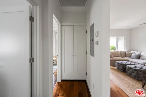 a bedroom with furniture and a book shelf