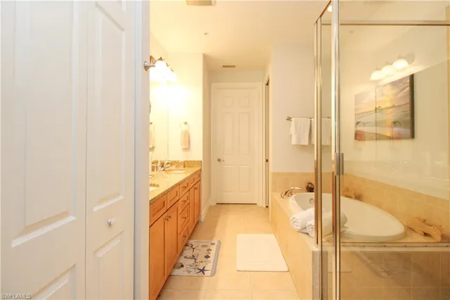 a bathroom with a double vanity sink and a mirror