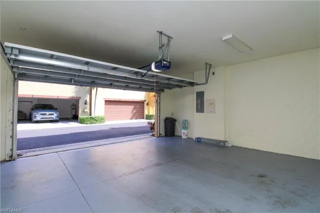 a view of a car garage door and a window