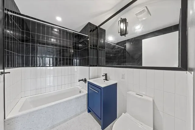 a view of room with window and wooden floor