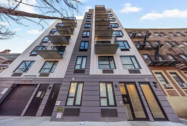 a bathroom with a bathtub a mirror a sink and vanity