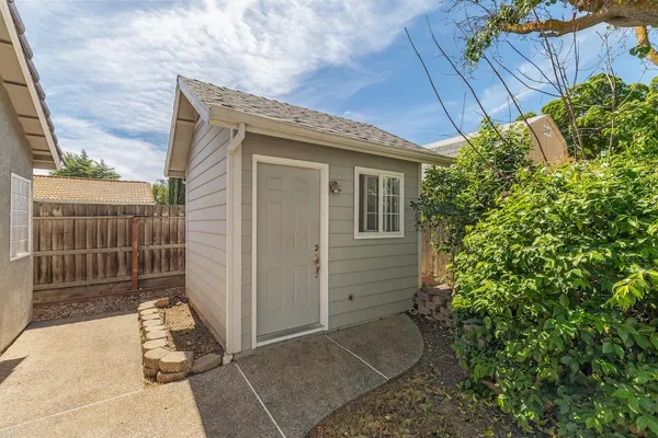 a view of a house with a fence