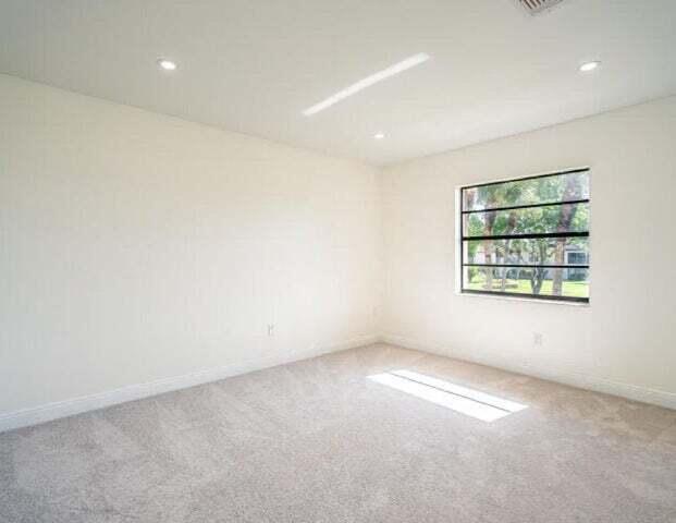 9284 Vista Del Lago, Unit 34F Boca Raton, FL 33428 - Photo 12 of 15 an empty room with windows and walls