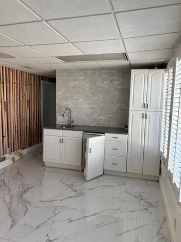 a bathroom with a sink a vanity and mirror