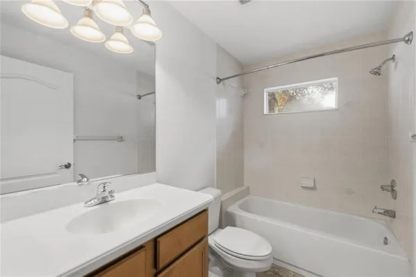 a bathroom with a sink a toilet and a bathtub