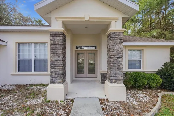 a front view of a house with a glass door