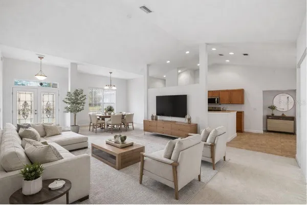 a living room with furniture and a flat screen tv