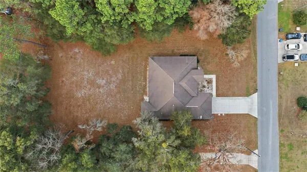 an aerial view of house with yard