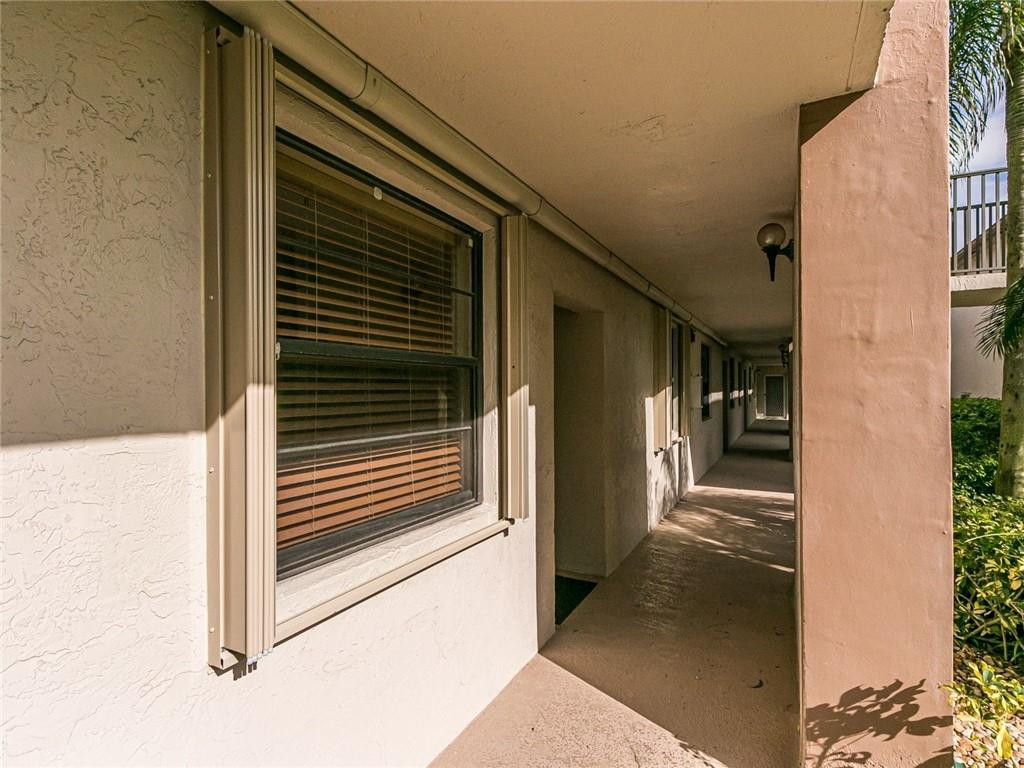 9569 West McNab Road, Unit 9569 Tamarac, FL 33321 - Photo 4 of 39 walkway to unit