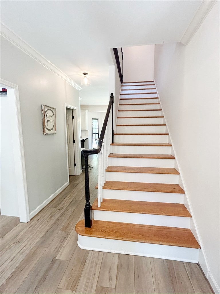 2004 Moores Mill Road Lanett, AL 36863 - Photo 19 of 50 This inviting entryway features elegant wood flooring and a classic staircase.