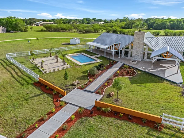 an aerial view of a house with a garden