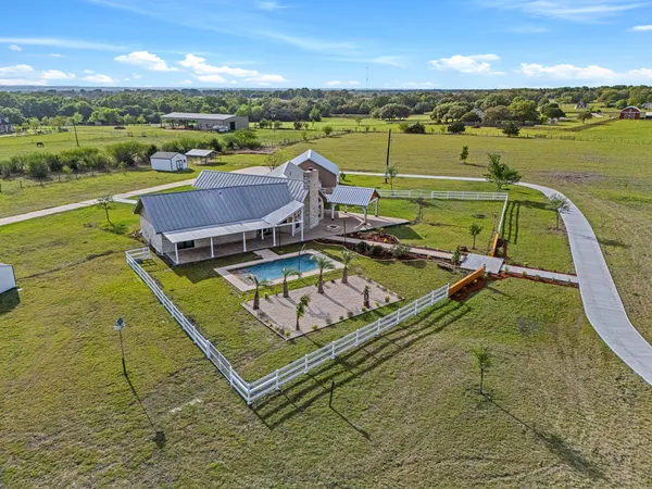 an aerial view of a house with a ocean view
