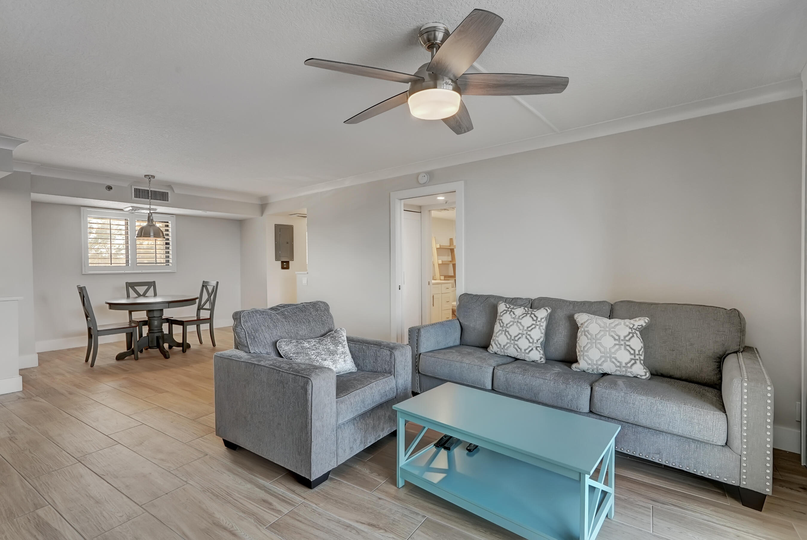 100 Ocean Trail Way, Unit 108 Jupiter, FL 33477 - Photo 11 of 30 a living room with furniture and a ceiling fan
