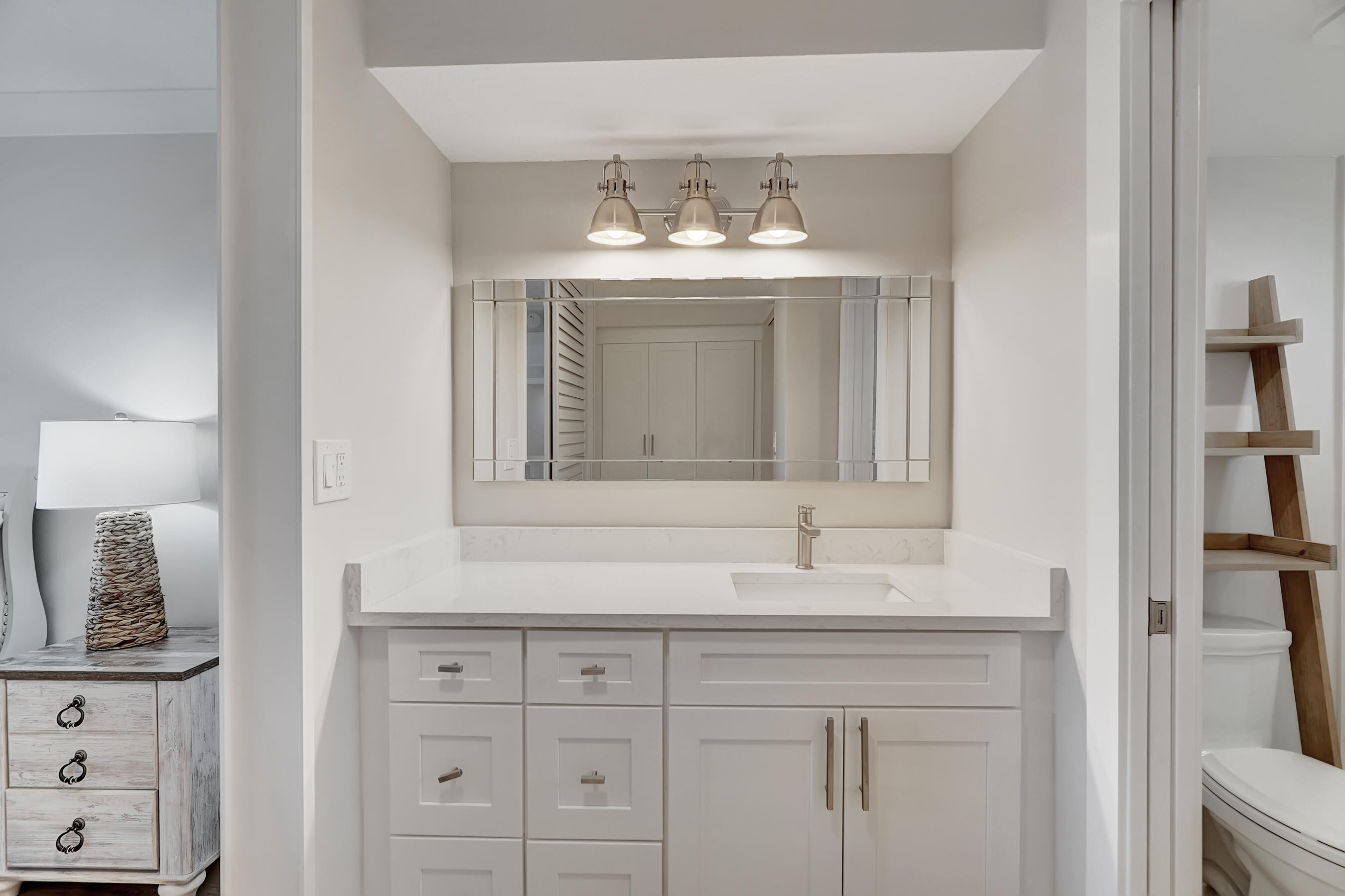 100 Ocean Trail Way, Unit 108 Jupiter, FL 33477 - Photo 19 of 30 a bathroom with a sink and a mirror