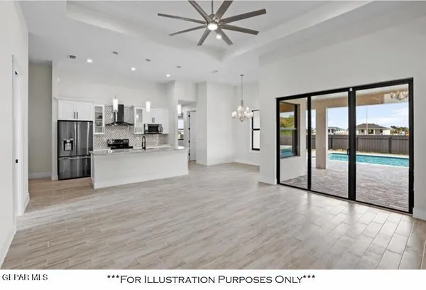 a kitchen with granite countertop a refrigerator stove top oven and sink
