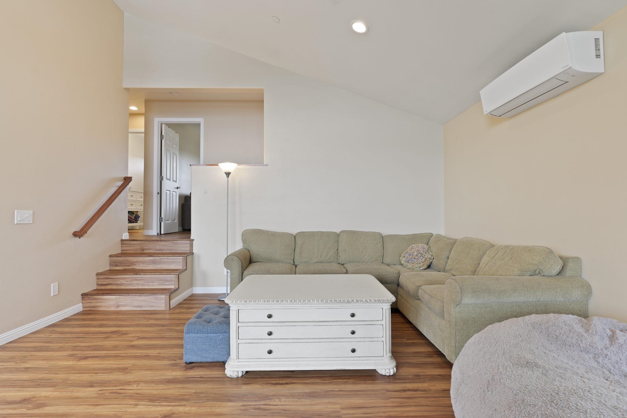 752 Awalau Road, Unit B Haiku, HI 96708 - Photo 20 of 30 a living room with furniture and a wooden floor