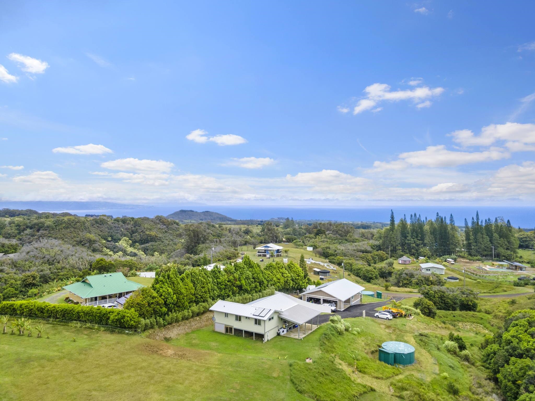 752 Awalau Road, Unit B Haiku, HI 96708 - Photo 6 of 30 a view of a city with lots of residential buildings ocean and mountain view in back