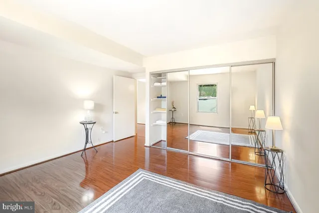 a view of a room with wooden floor and chair