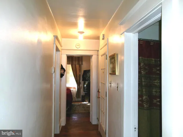 a view of staircase with wooden floor and a window