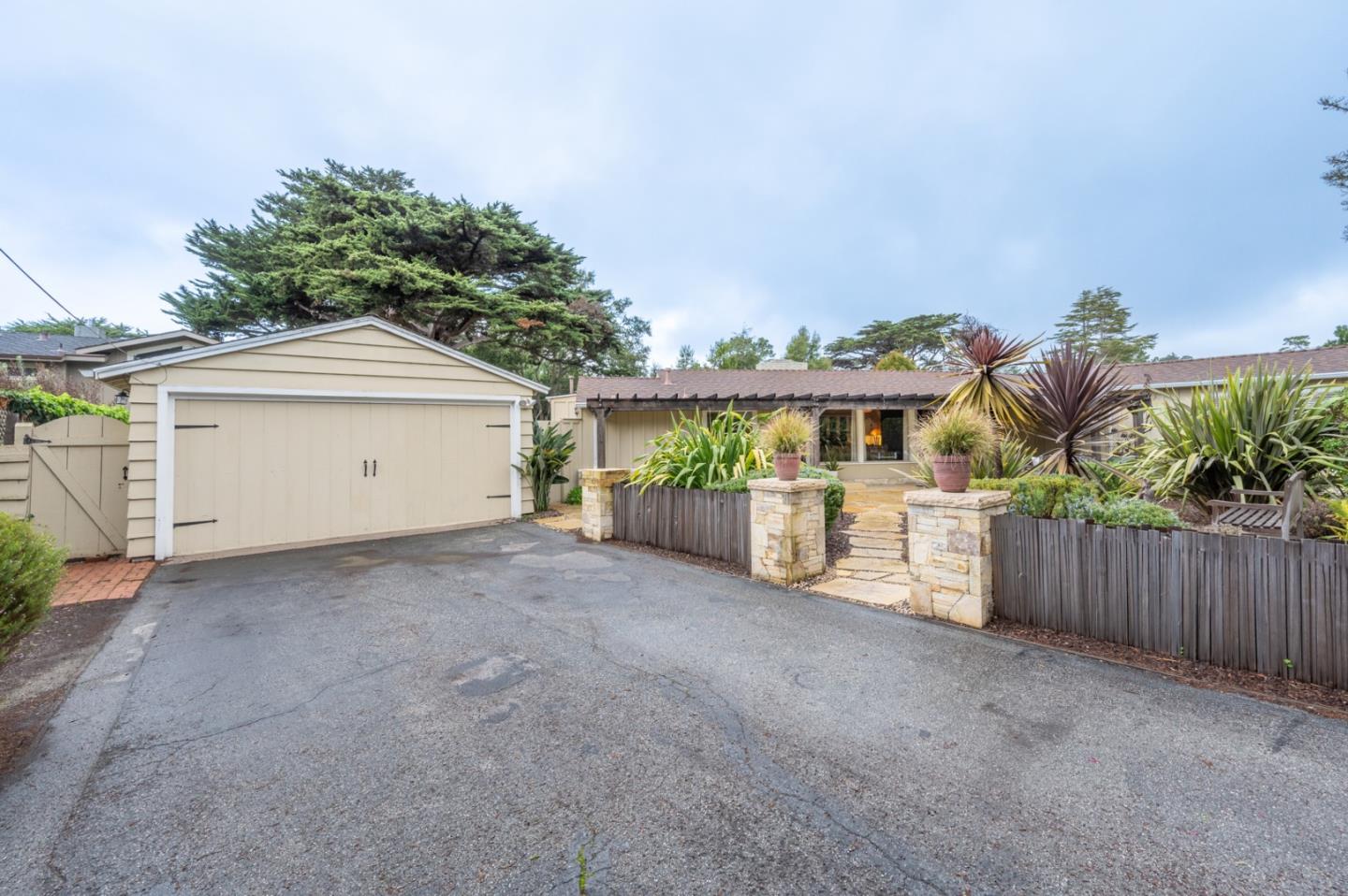 26208 Atherton Drive Carmel, CA 93923 - Photo 17 of 22 a view of a house with a yard and wooden fence