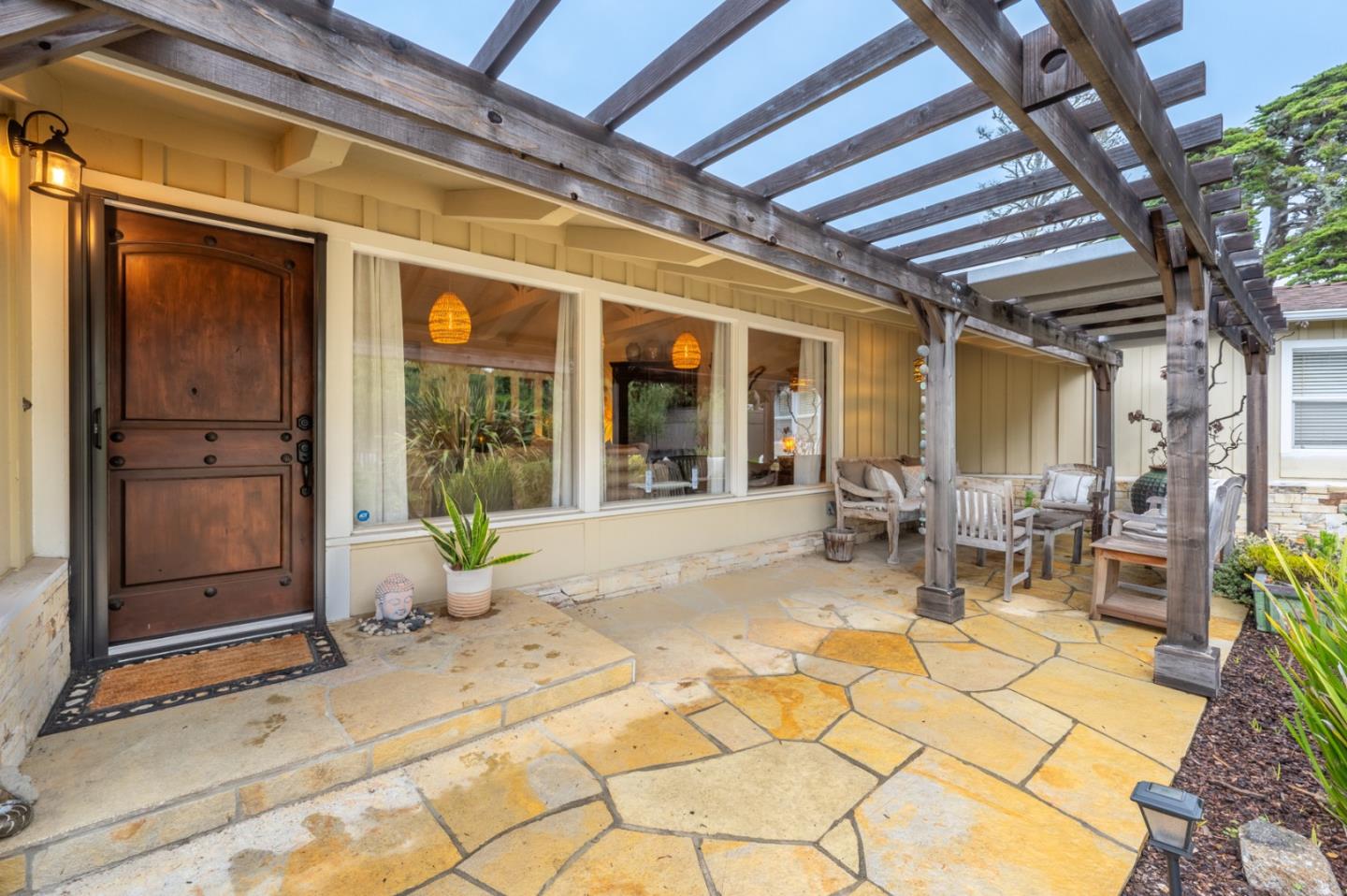 26208 Atherton Drive Carmel, CA 93923 - Photo 2 of 22 a building outdoor space with patio furniture and potted plants