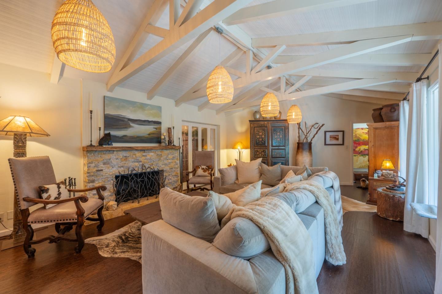 26208 Atherton Drive Carmel, CA 93923 - Photo 3 of 22 a living room with furniture a fireplace and a chandelier
