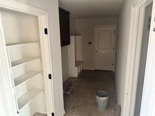 a bathroom view of a toilet and a shower