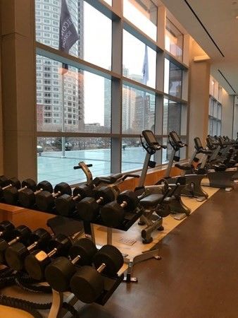 a living room with furniture and a mirror