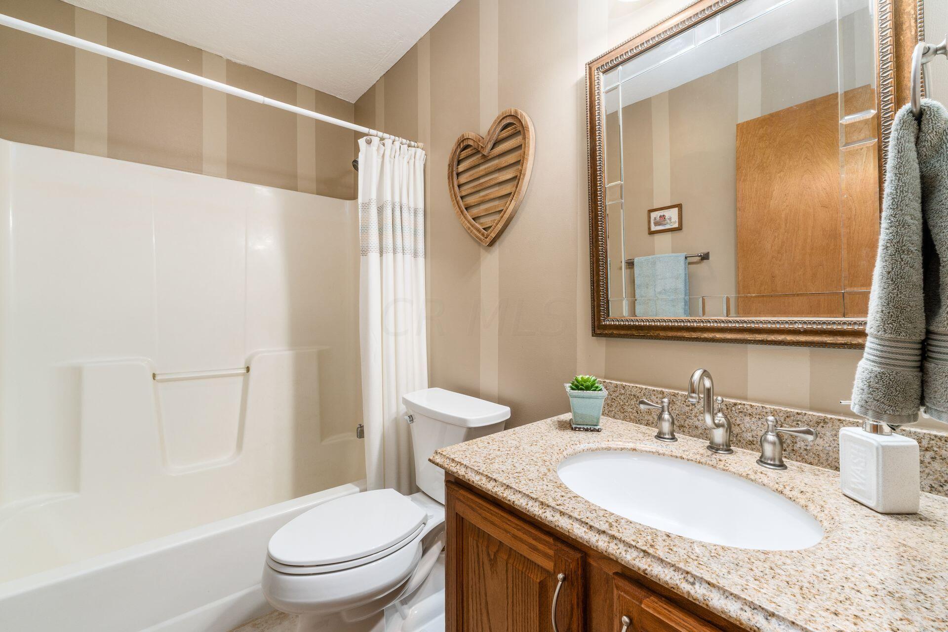 10950 Heimberger Road Northwest Baltimore, OH 43105 - Photo 38 of 45 Elongated Toilet & Vanity w/ Granite Countertop