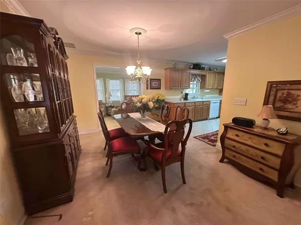 a kitchen with a sink window and cabinets