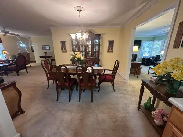 a kitchen with refrigerator and cabinets