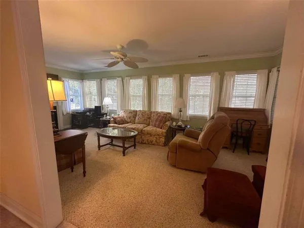 a living room with furniture and a window