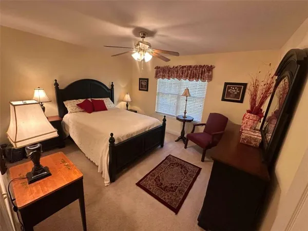 a bed room with a bed and a lamp