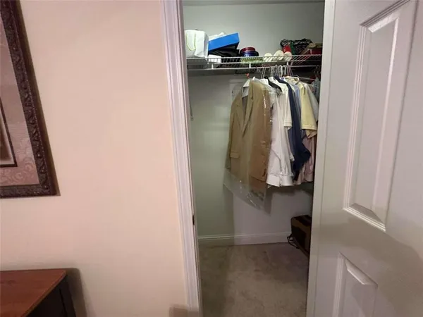 a bathroom with a sink toilet vanity and shower