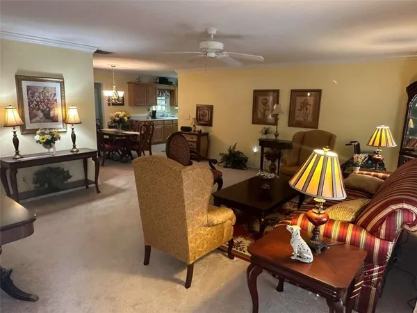 a view of a dining room with furniture and window