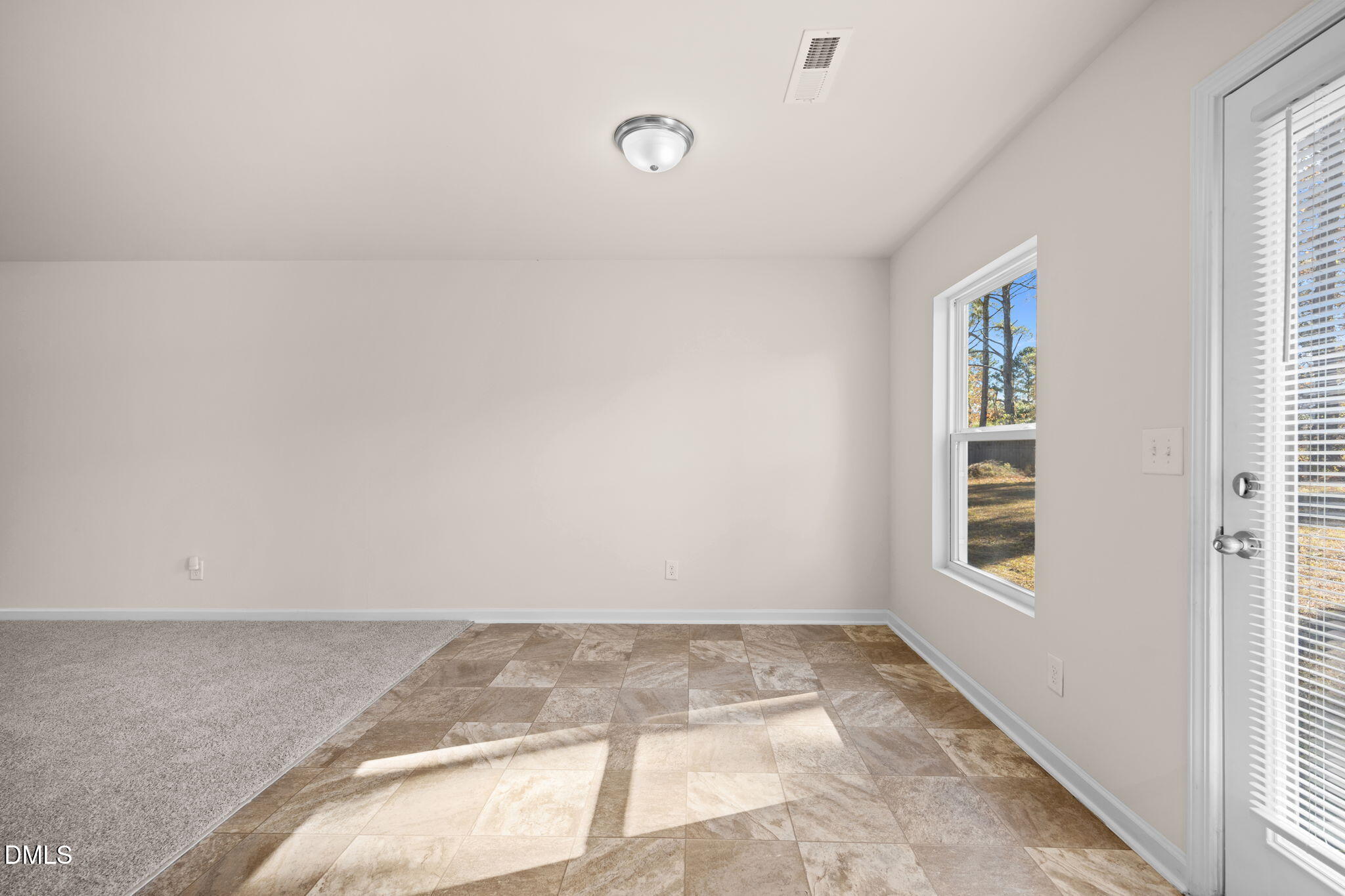 107 Deanne Lane Coats, NC 27521 - Photo 10 of 35 a view of a room with wooden floor and window