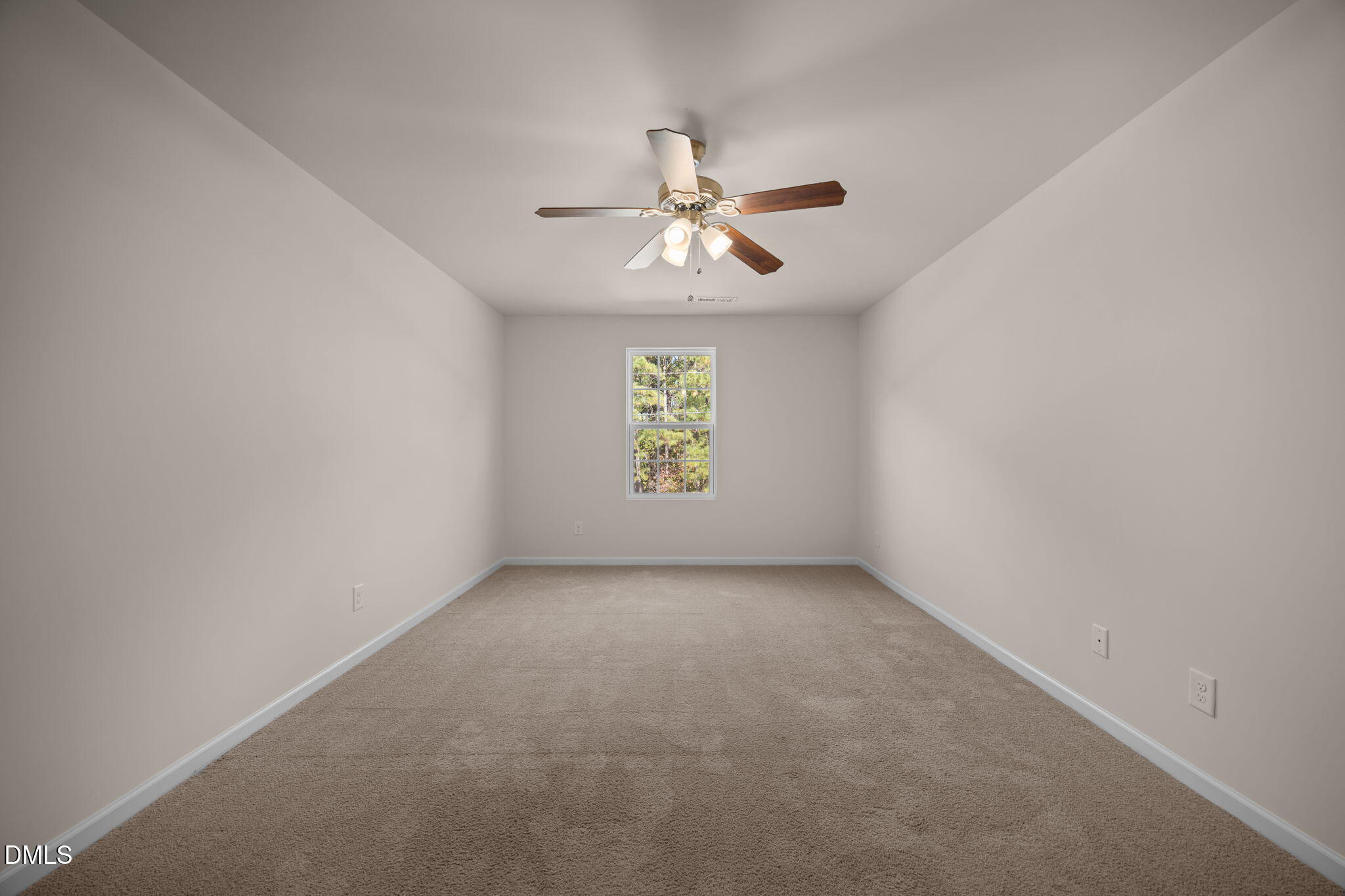 107 Deanne Lane Coats, NC 27521 - Photo 16 of 35 an empty room with windows and fan