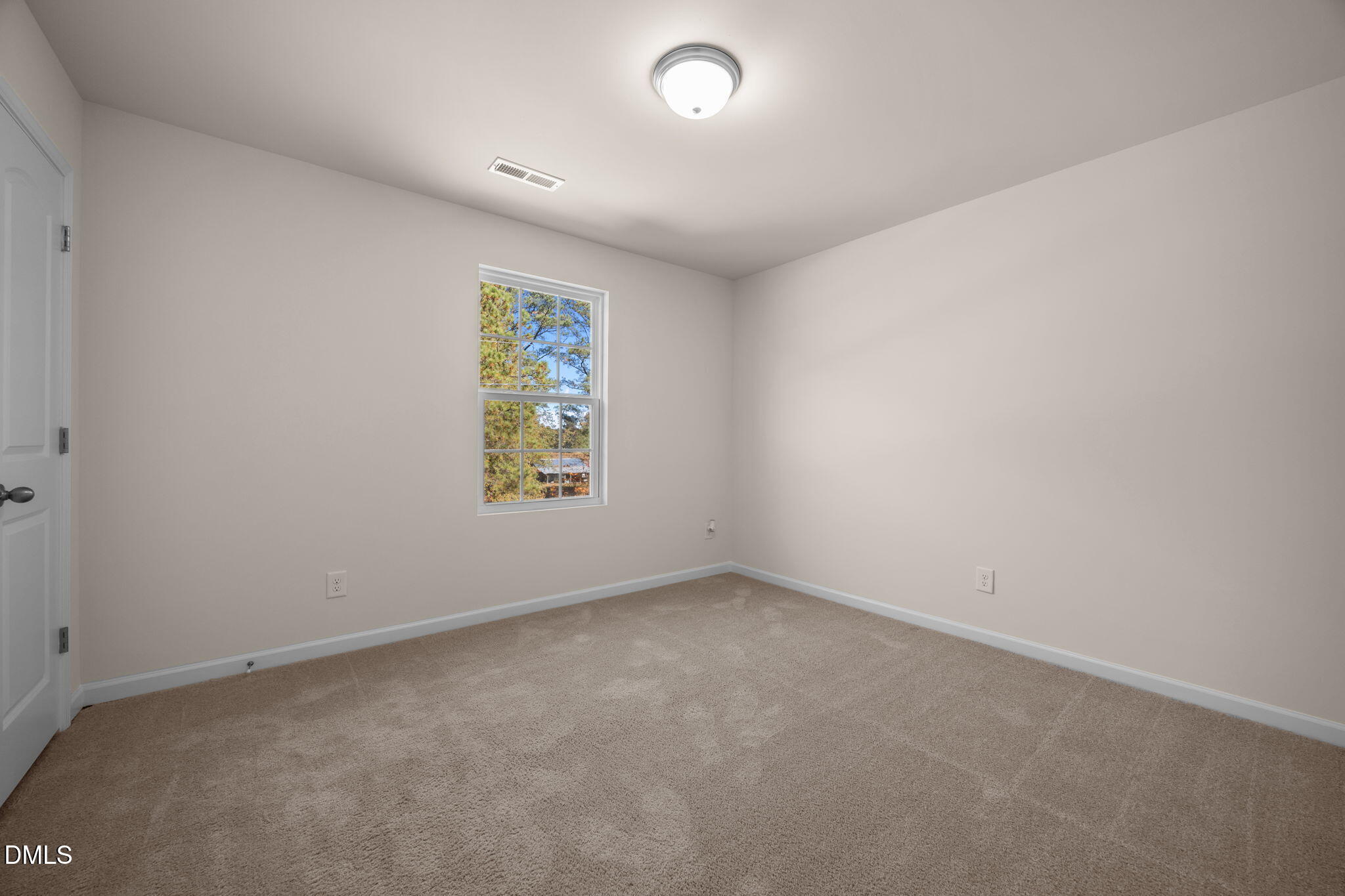 107 Deanne Lane Coats, NC 27521 - Photo 24 of 35 an empty room with windows