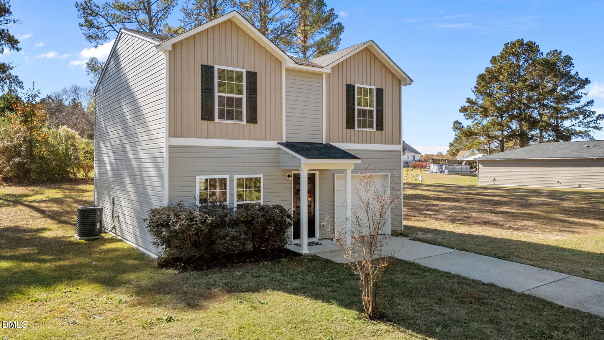 107 Deanne Lane Coats, NC 27521 - Photo 2 of 35 a view of a house with a yard and large tree