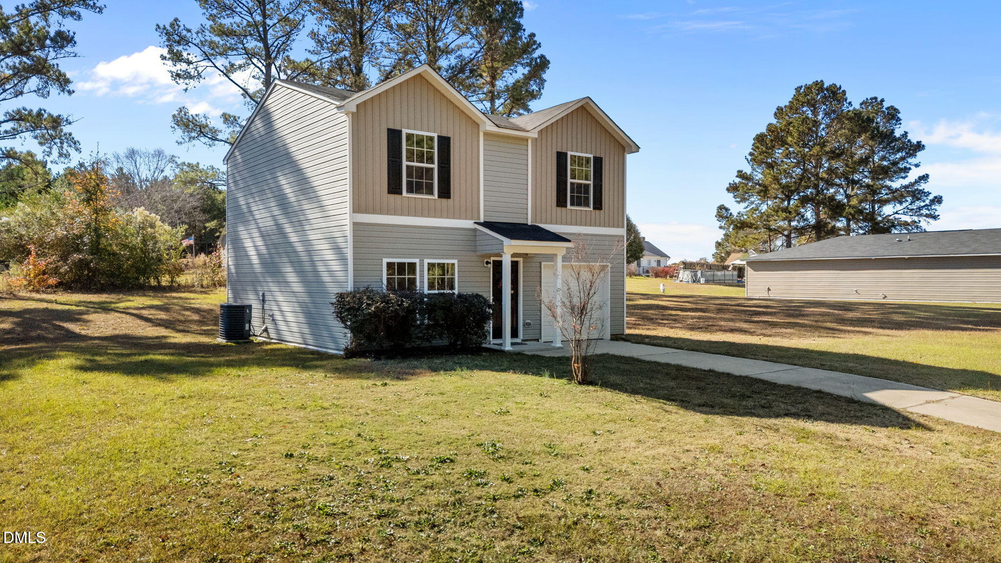 107 Deanne Lane Coats, NC 27521 - Photo 3 of 35 a view of a house with a swimming pool