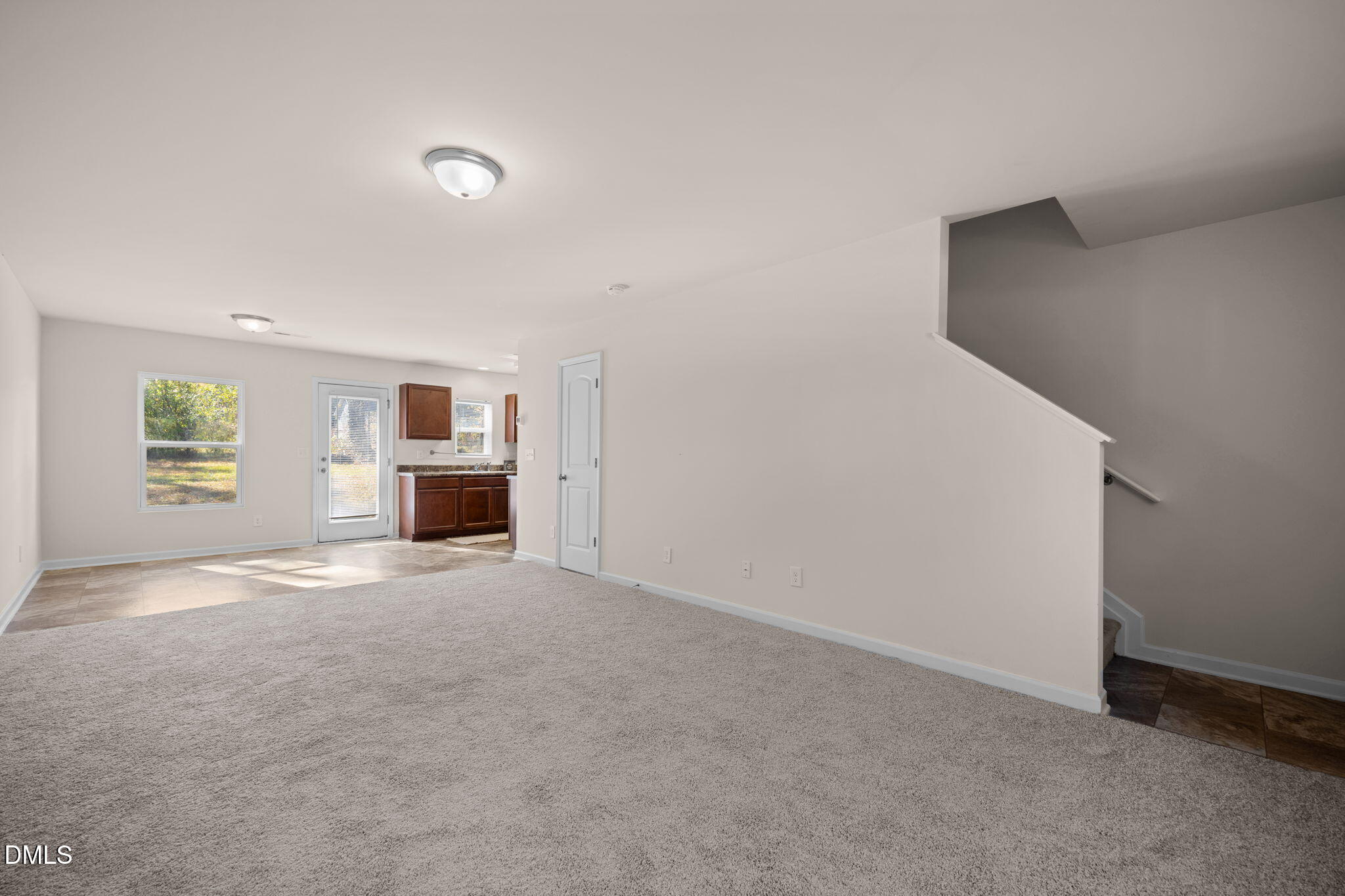 107 Deanne Lane Coats, NC 27521 - Photo 5 of 35 an empty room with kitchen stove and a refrigerator