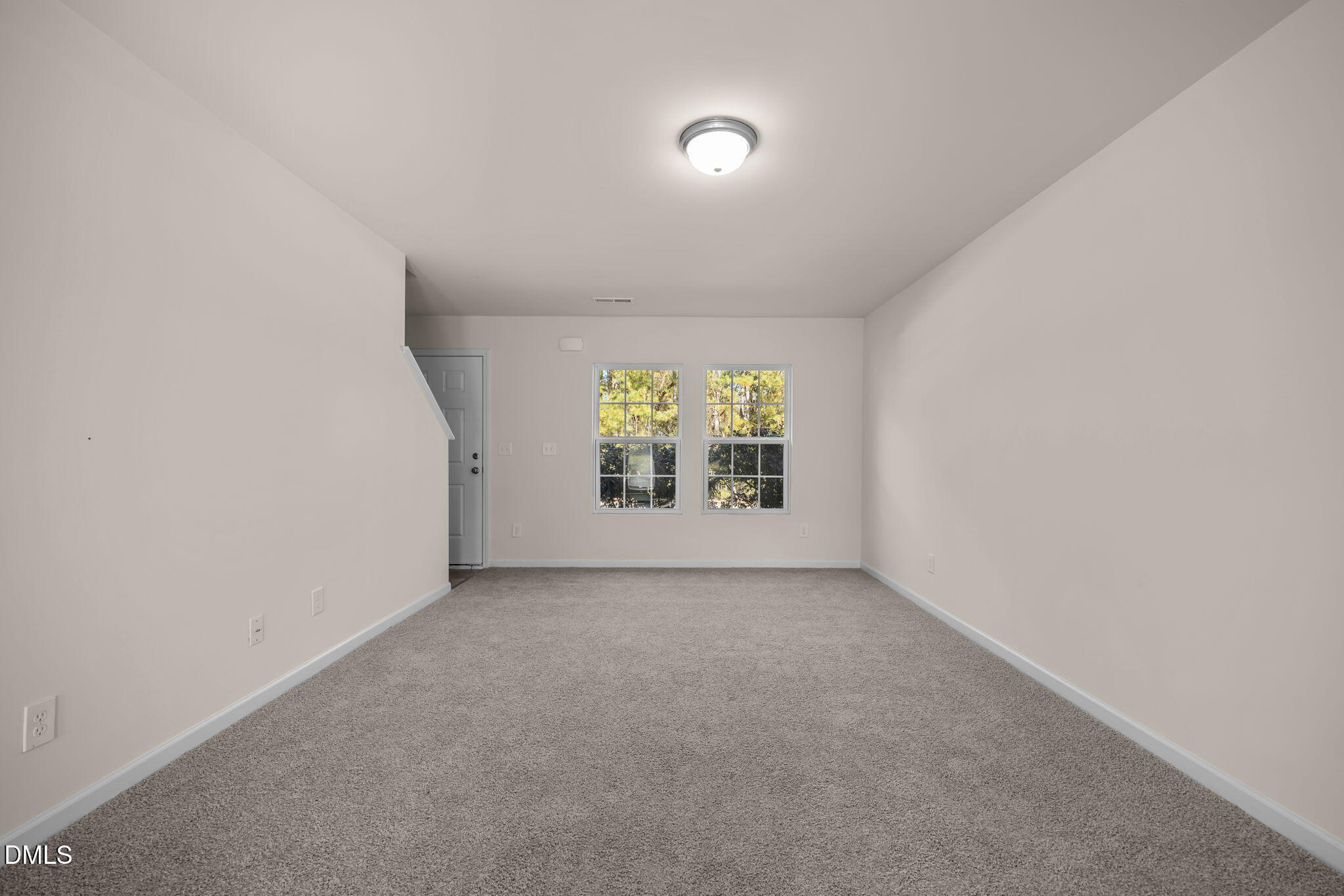 107 Deanne Lane Coats, NC 27521 - Photo 6 of 35 an empty room with windows