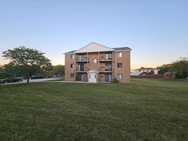 a view of a big house with a big yard